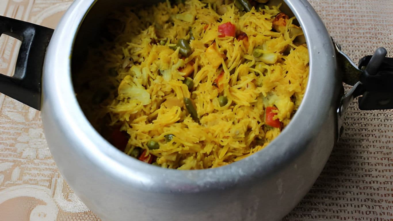 Vegetable rice pilaf in stainless steel pressure cooker