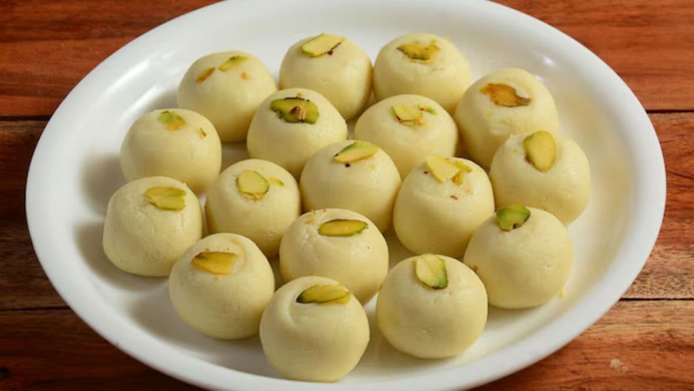 Indian milk sweets garnished with pistachio on plate