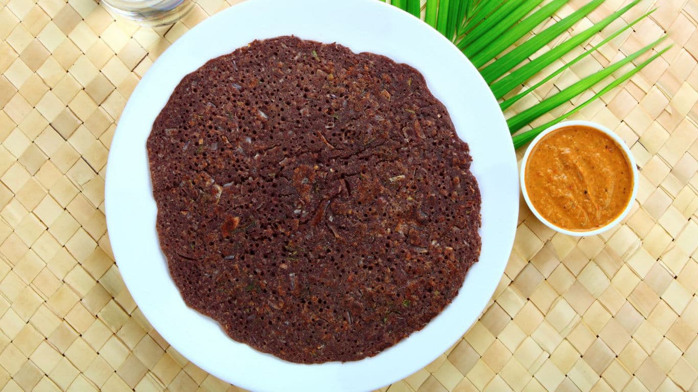 Ragi dosa with chutney on woven mat