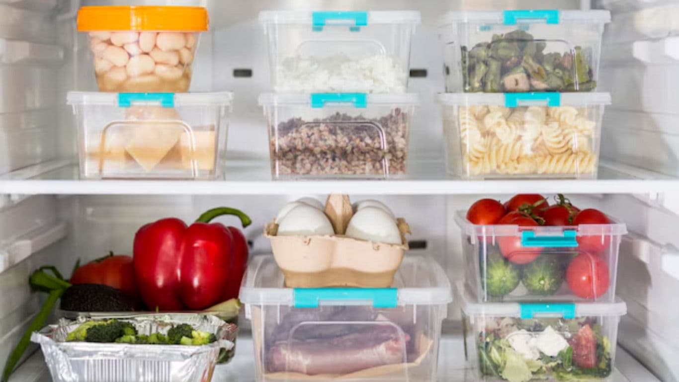 Organized refrigerator shelves with assorted fresh foods