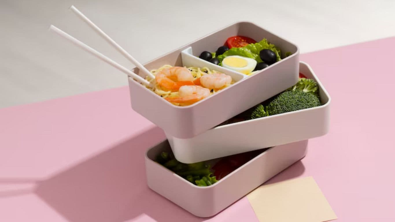 Stacked lunch boxes with fresh food