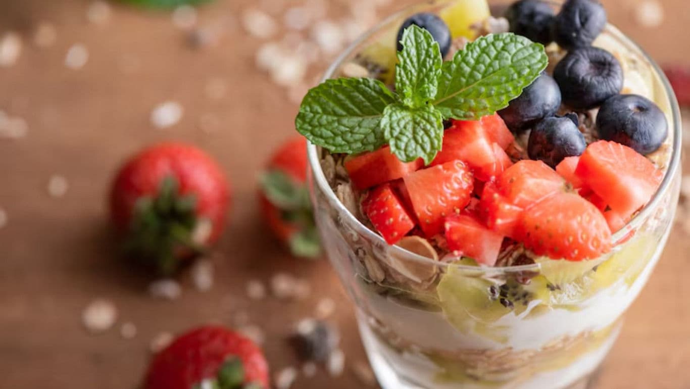 Fresh fruit parfait with mint garnish