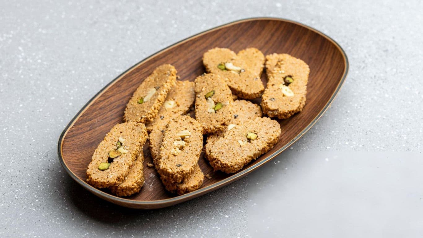 Pistachio cookies on wooden platter