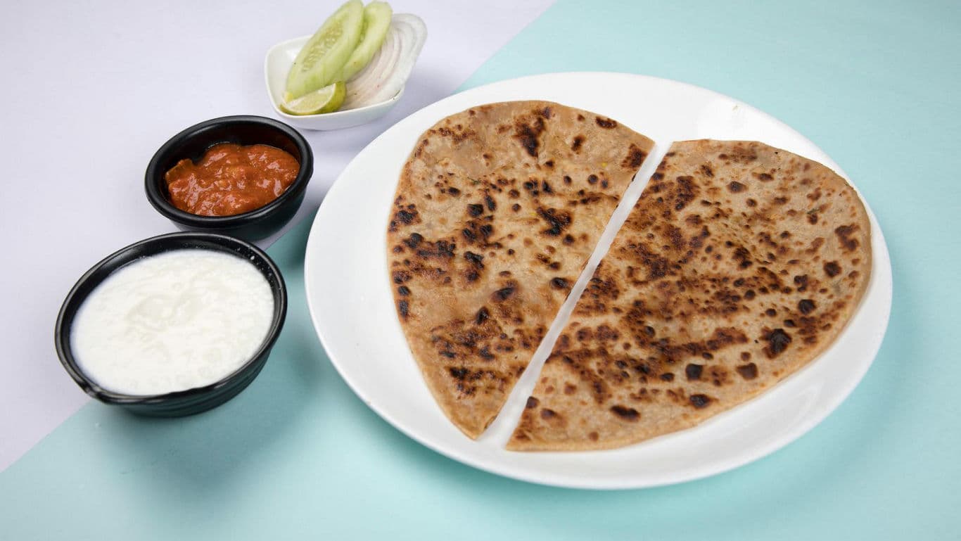 Indian stuffed paratha with condiments