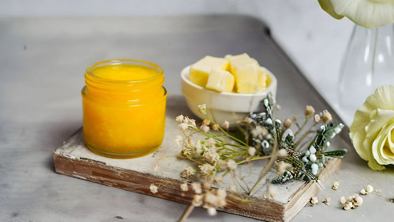 Ghee and butter on a wooden tray