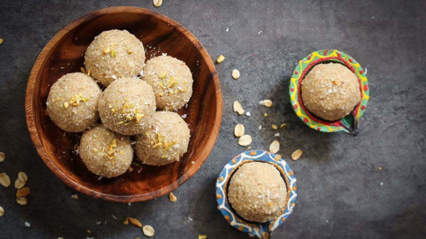 Rustic oat energy balls in wooden bowl