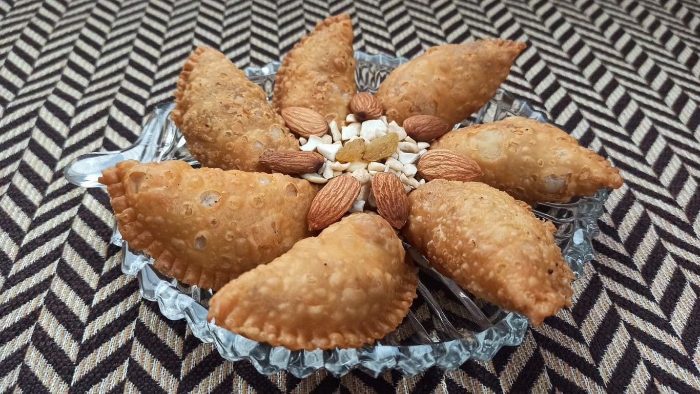 Traditional fried pastries with nuts display