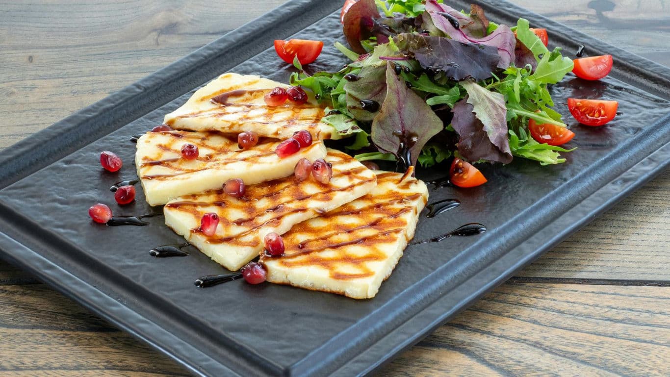 Grilled cheese slices with fresh salad