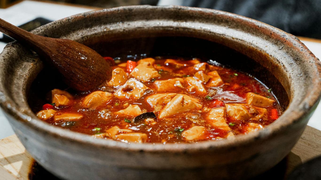 Spicy Tofu Stew Simmering in Clay Pot