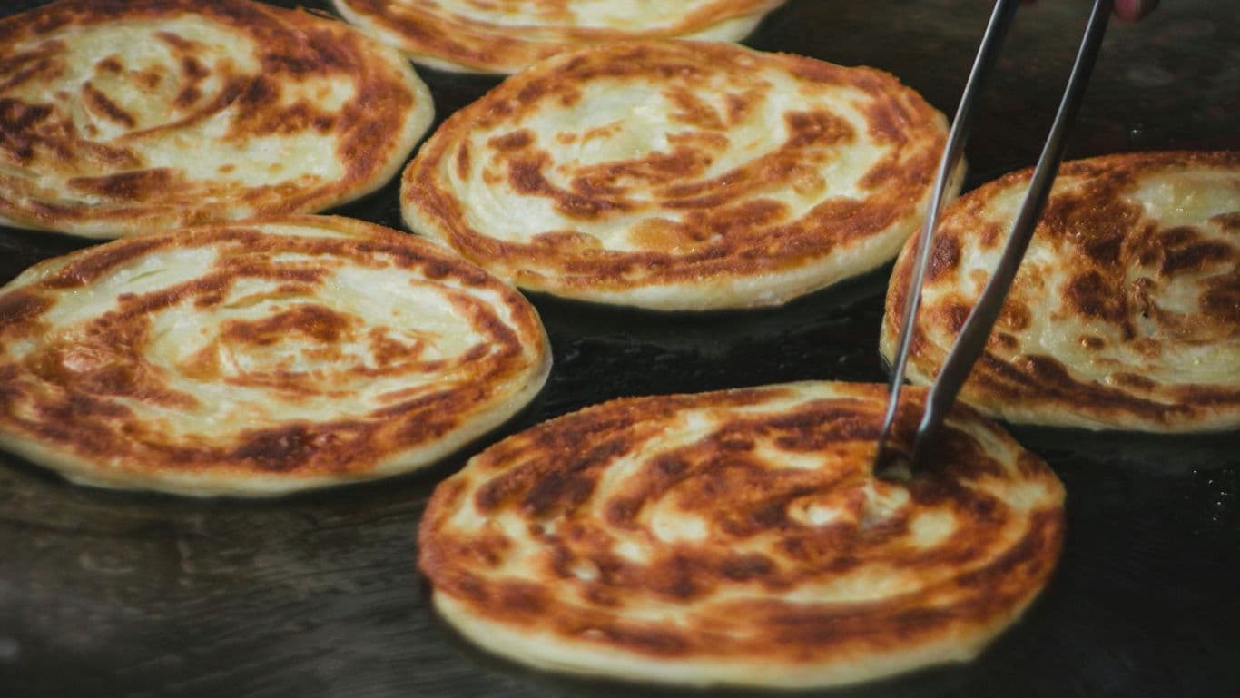 Freshly Cooked Flatbreads on Hot Griddle Surface