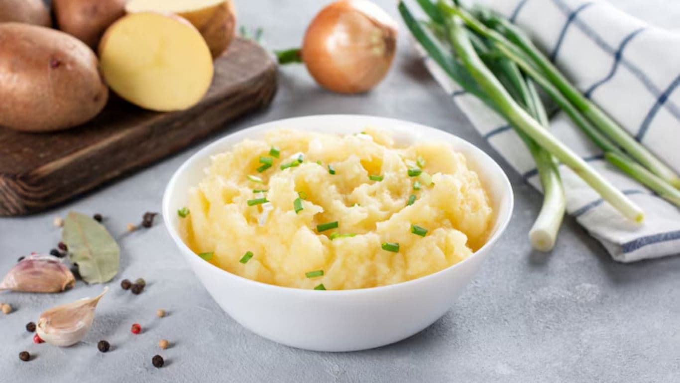 Creamy mashed potatoes with fresh garnish