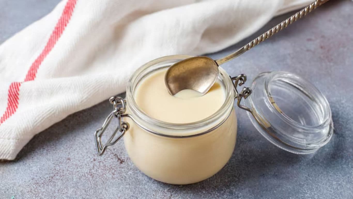 Glass jar of creamy white sauce