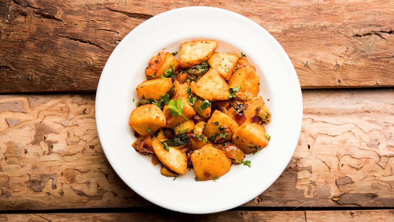 Spiced roasted potatoes on white plate