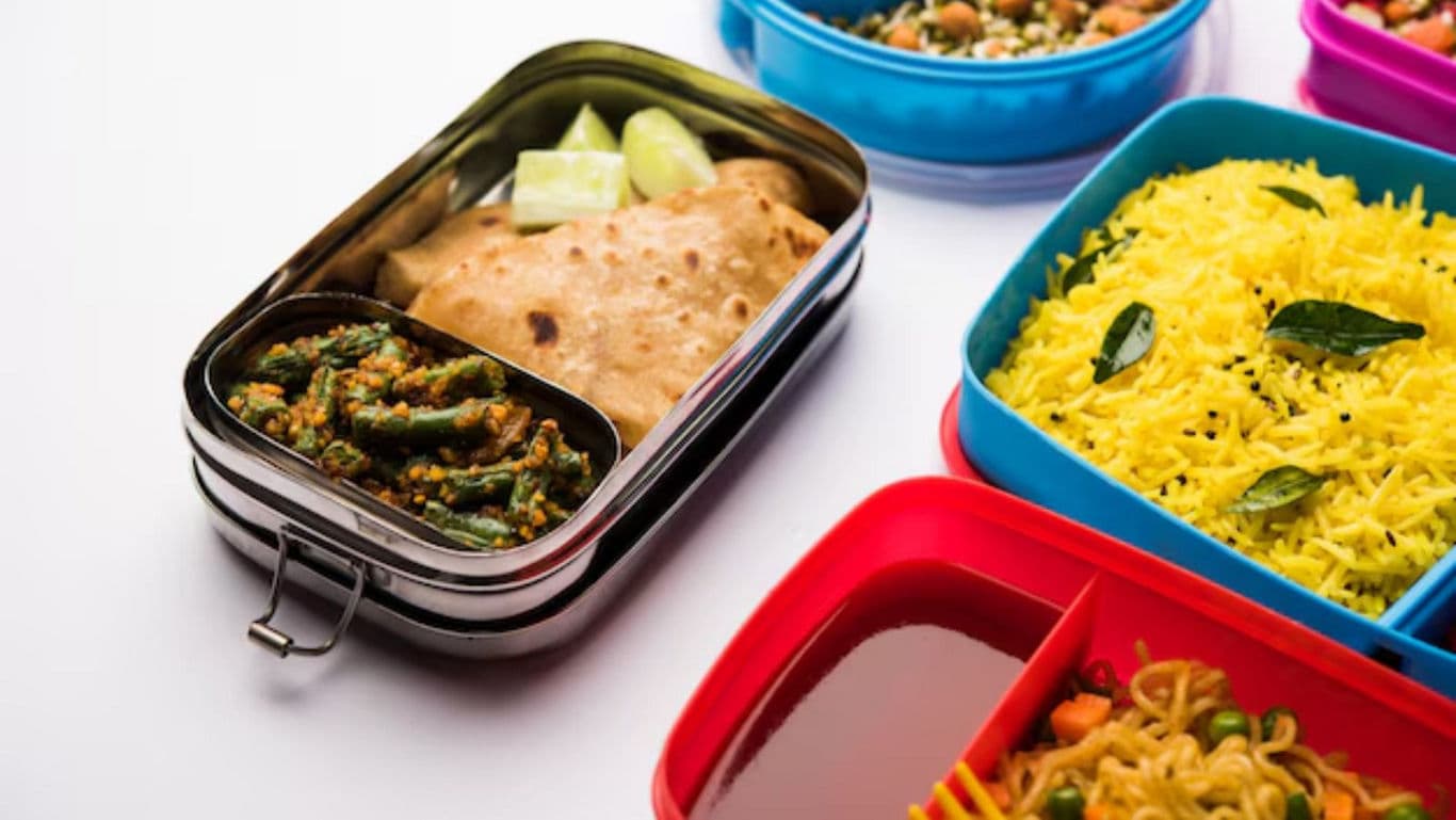 Colorful lunchboxes with Indian meals