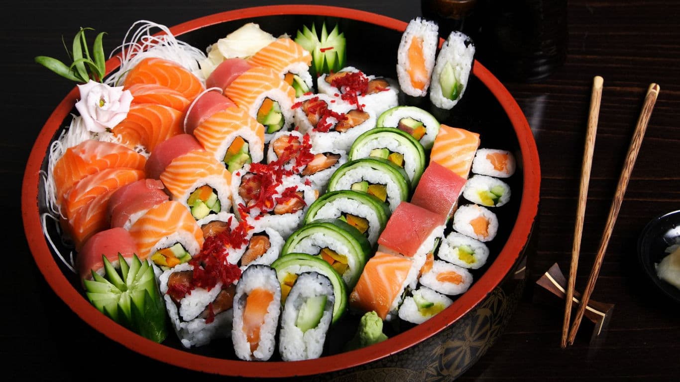 Assorted sushi platter with vibrant rolls and sashimi
