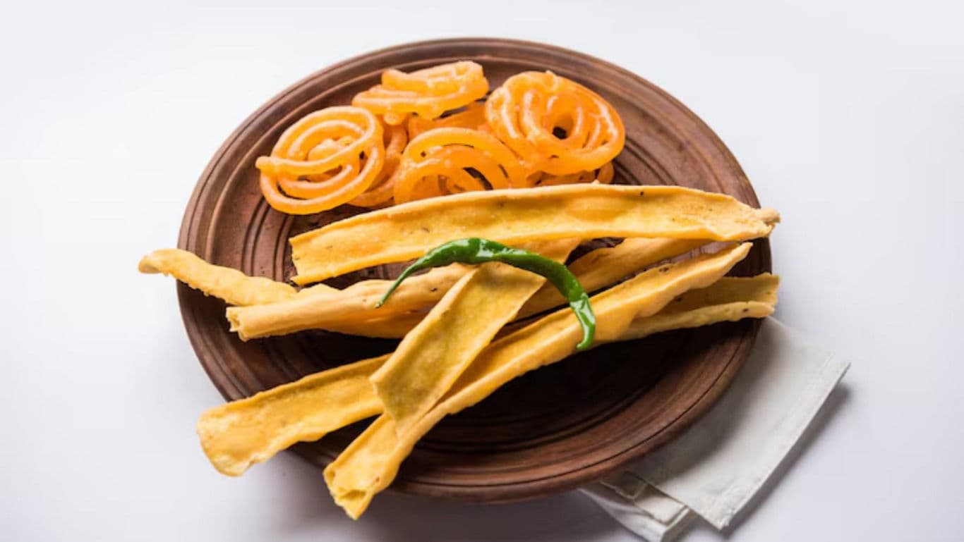 Traditional Indian snacks on wooden plate