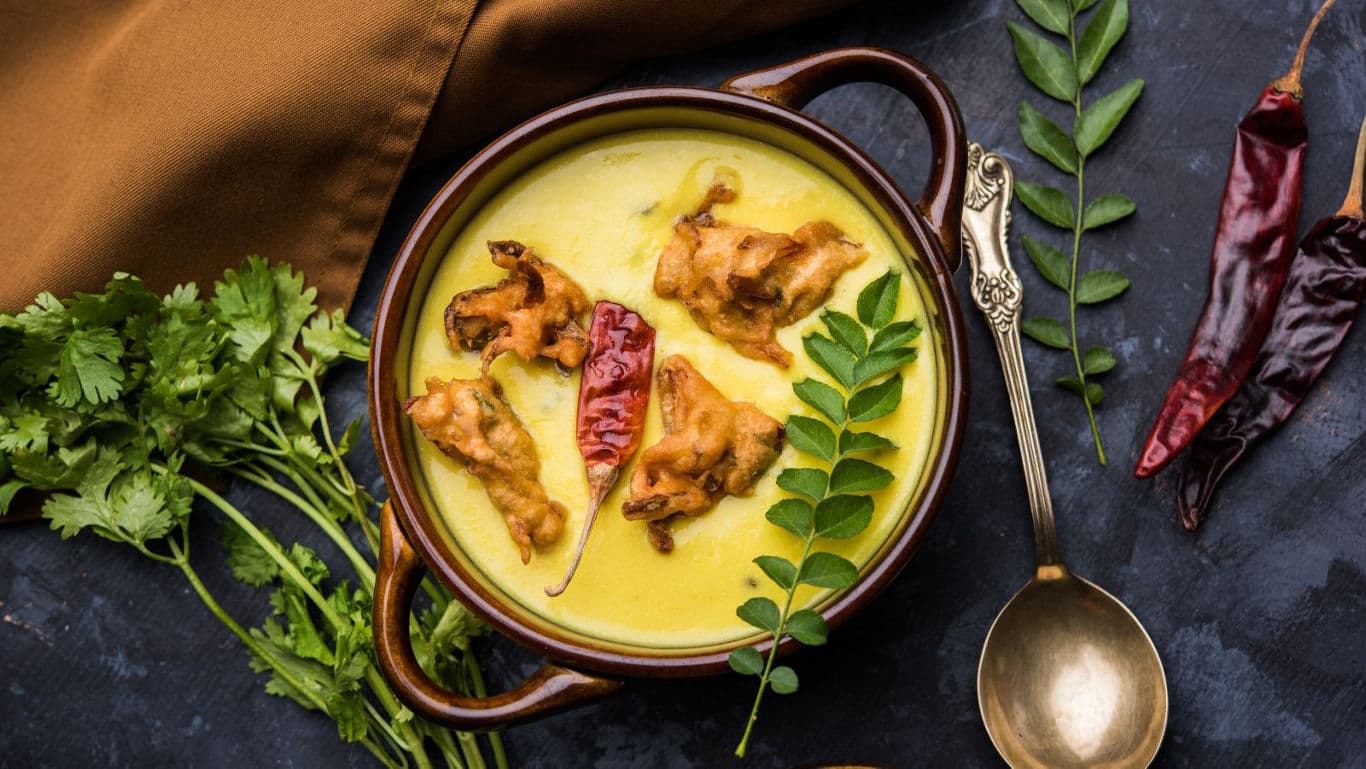 Traditional Indian curry with fried fritters