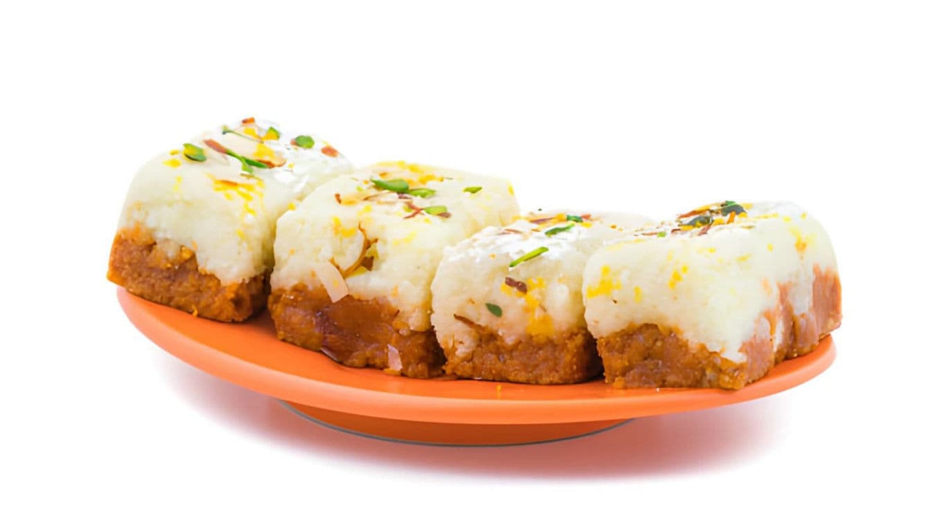 Traditional dessert squares on orange plate