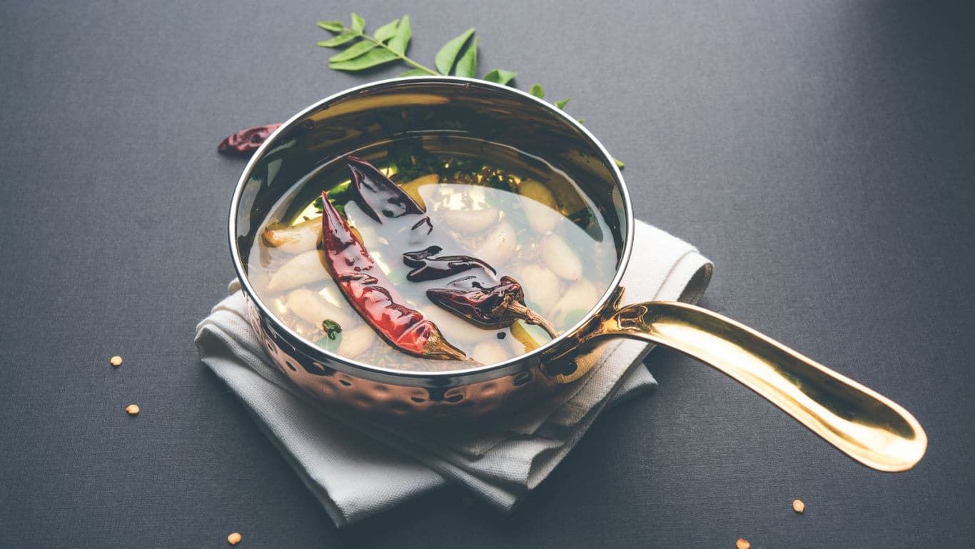 Copper pan with spicy Indian curry