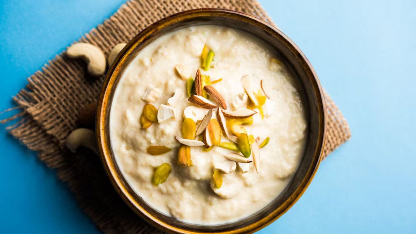 Creamy dessert bowl with nuts garnish