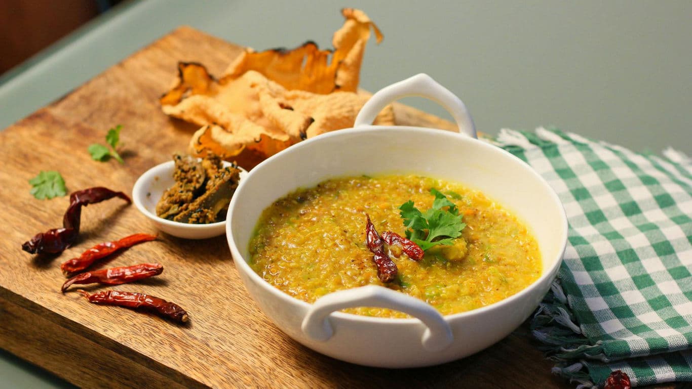 Spicy lentil curry with chili garnish