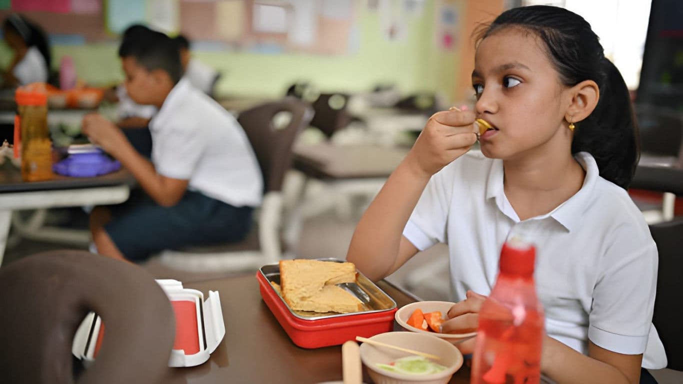 Kid eating lunch at school