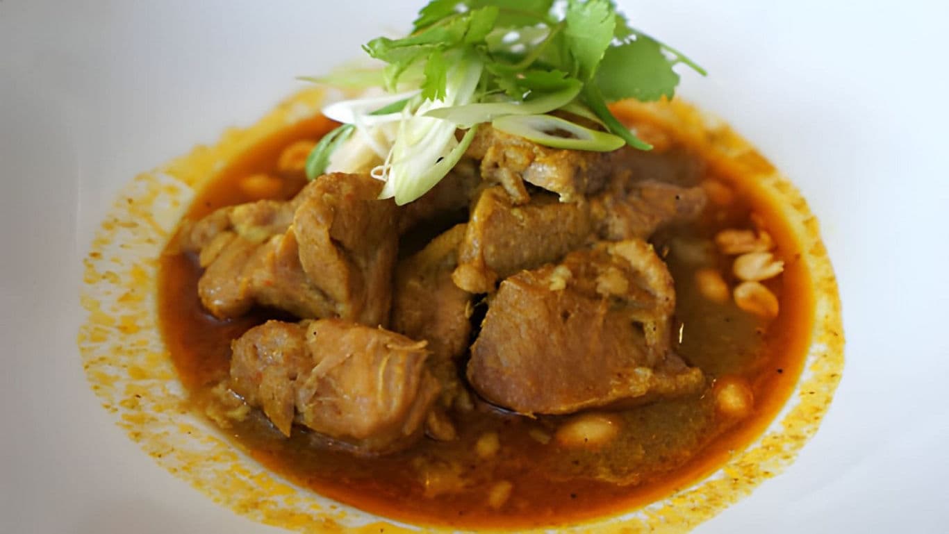 Braised Pork Stew with Fresh Herb Garnish