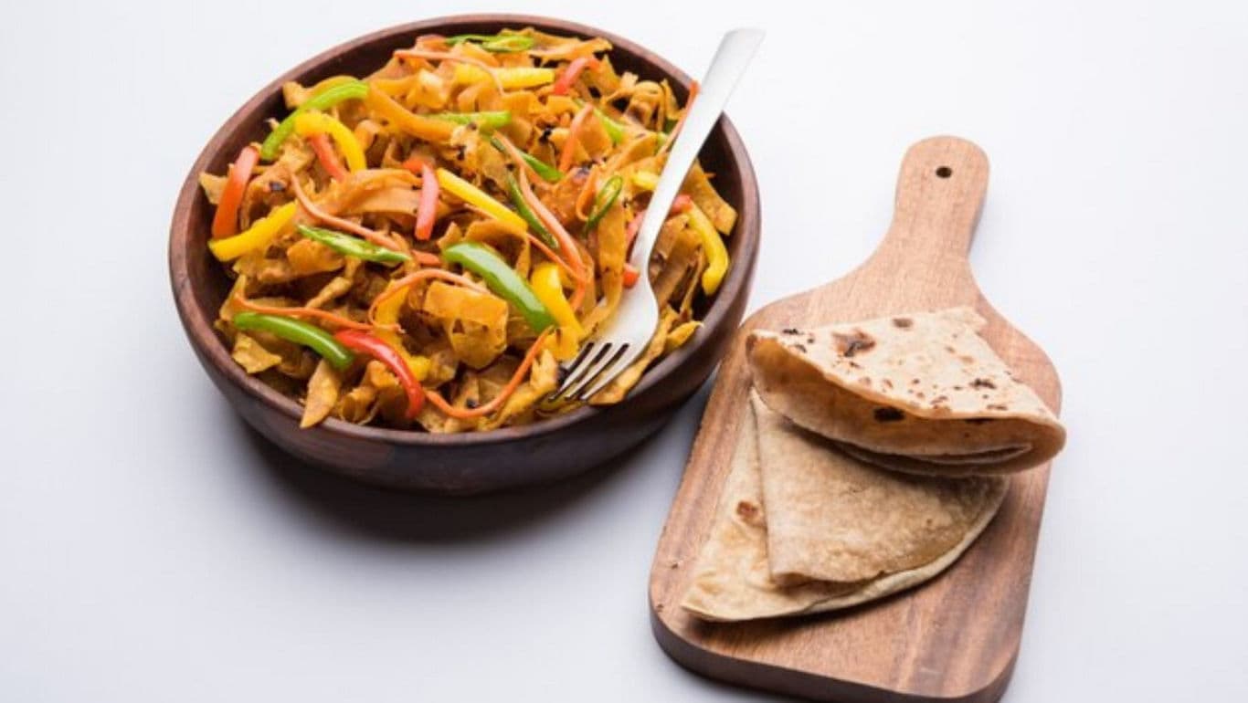Colorful vegetable stir-fry with flatbread