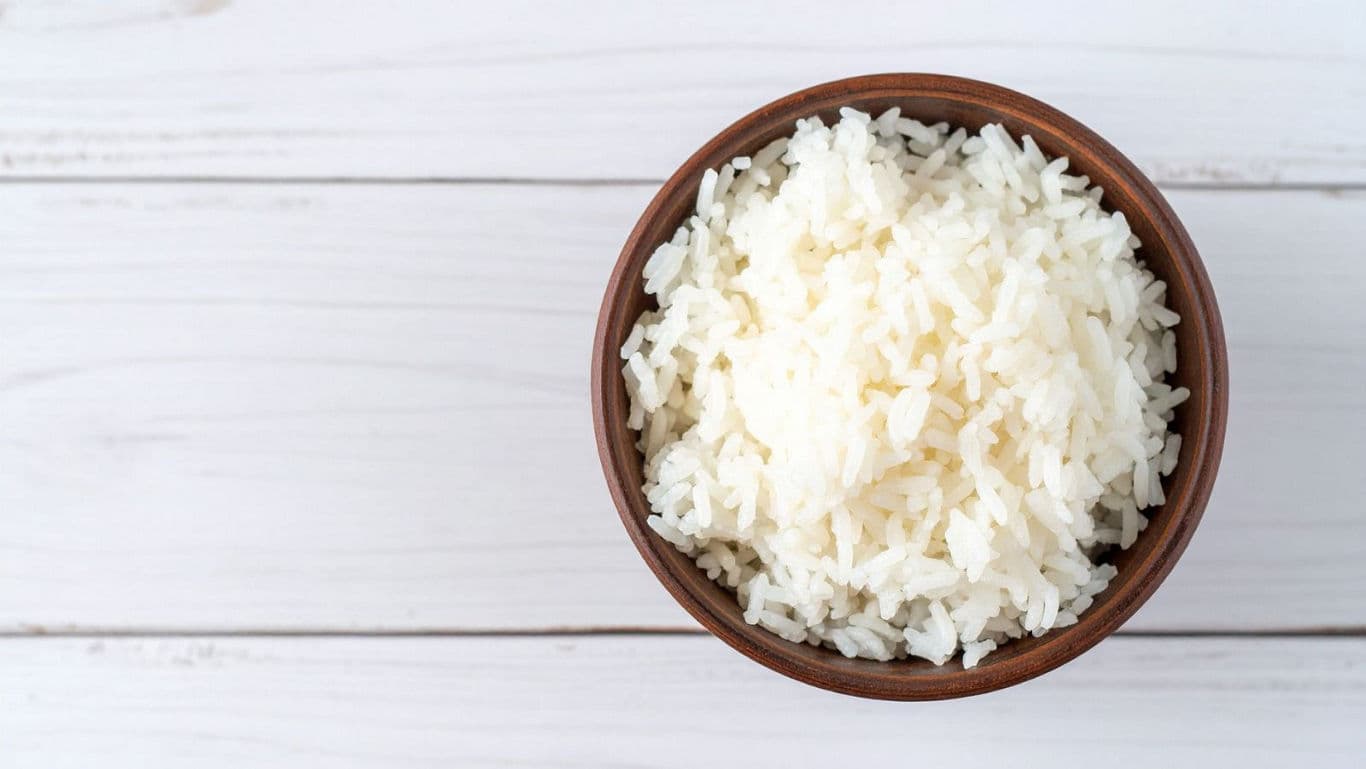 bowl of rice on a table banner image