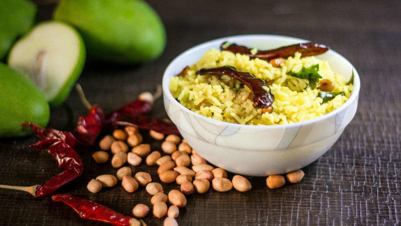 Spicy mango rice with peanuts and chilies