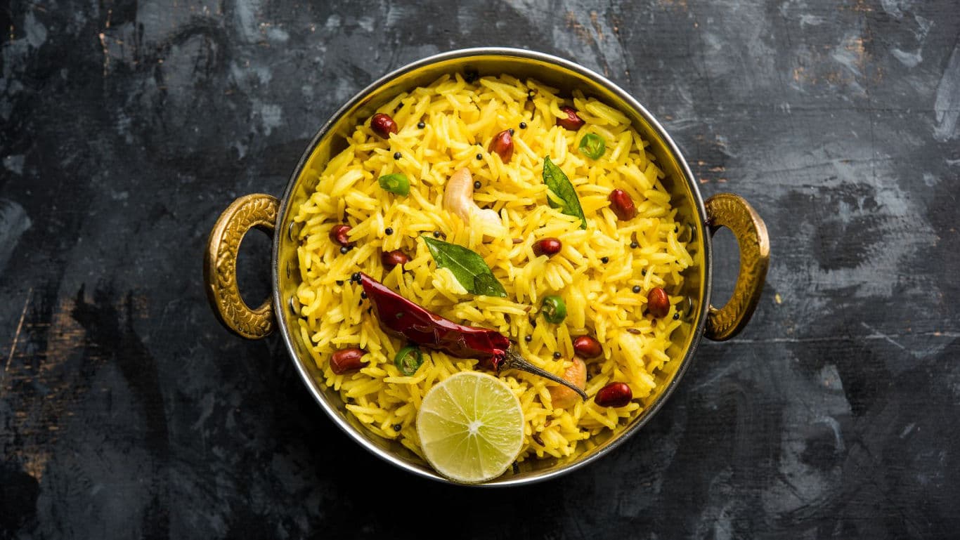 Traditional Indian lemon rice in brass bowl