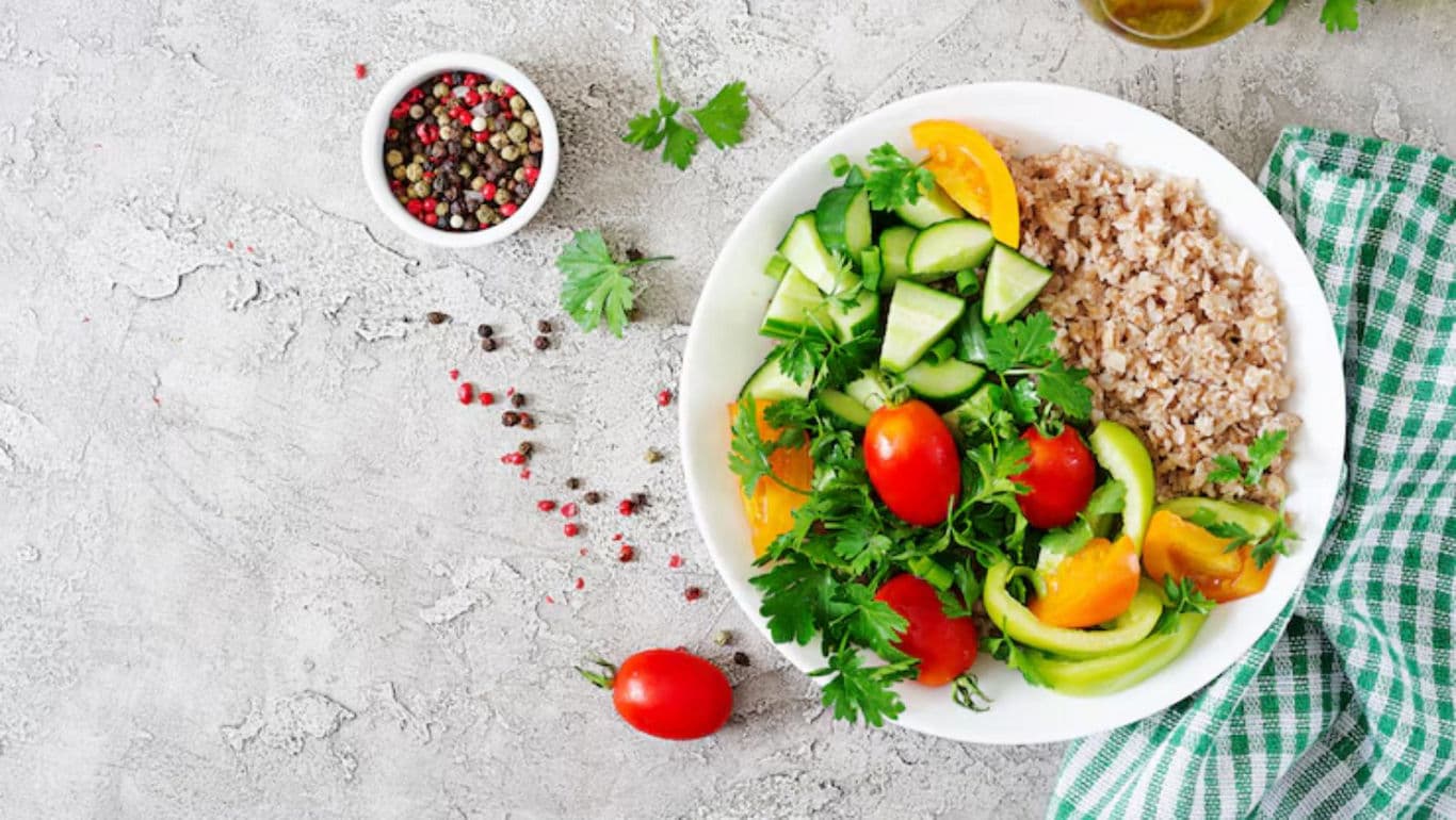 Fresh vegetable salad with grains on table