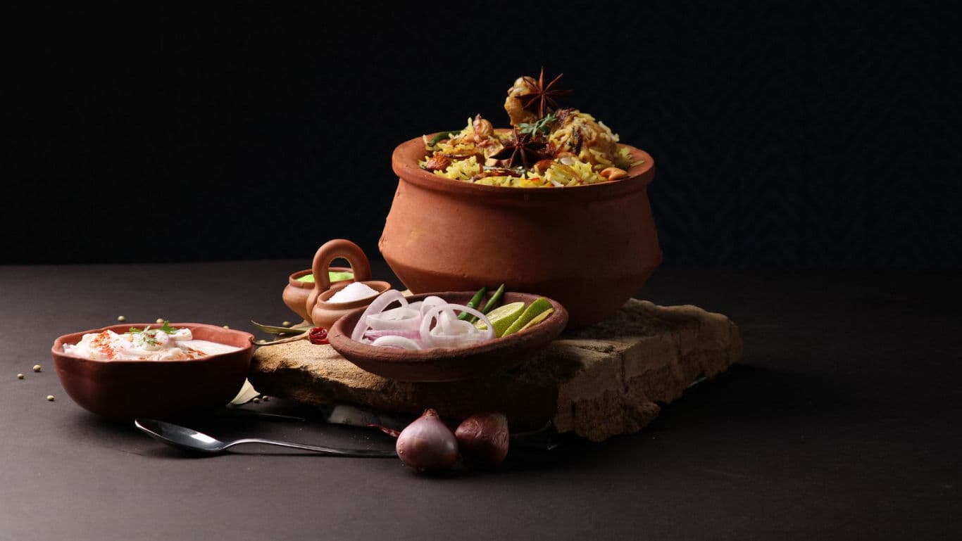 Dum pukht biryani with yoghurt - banner image