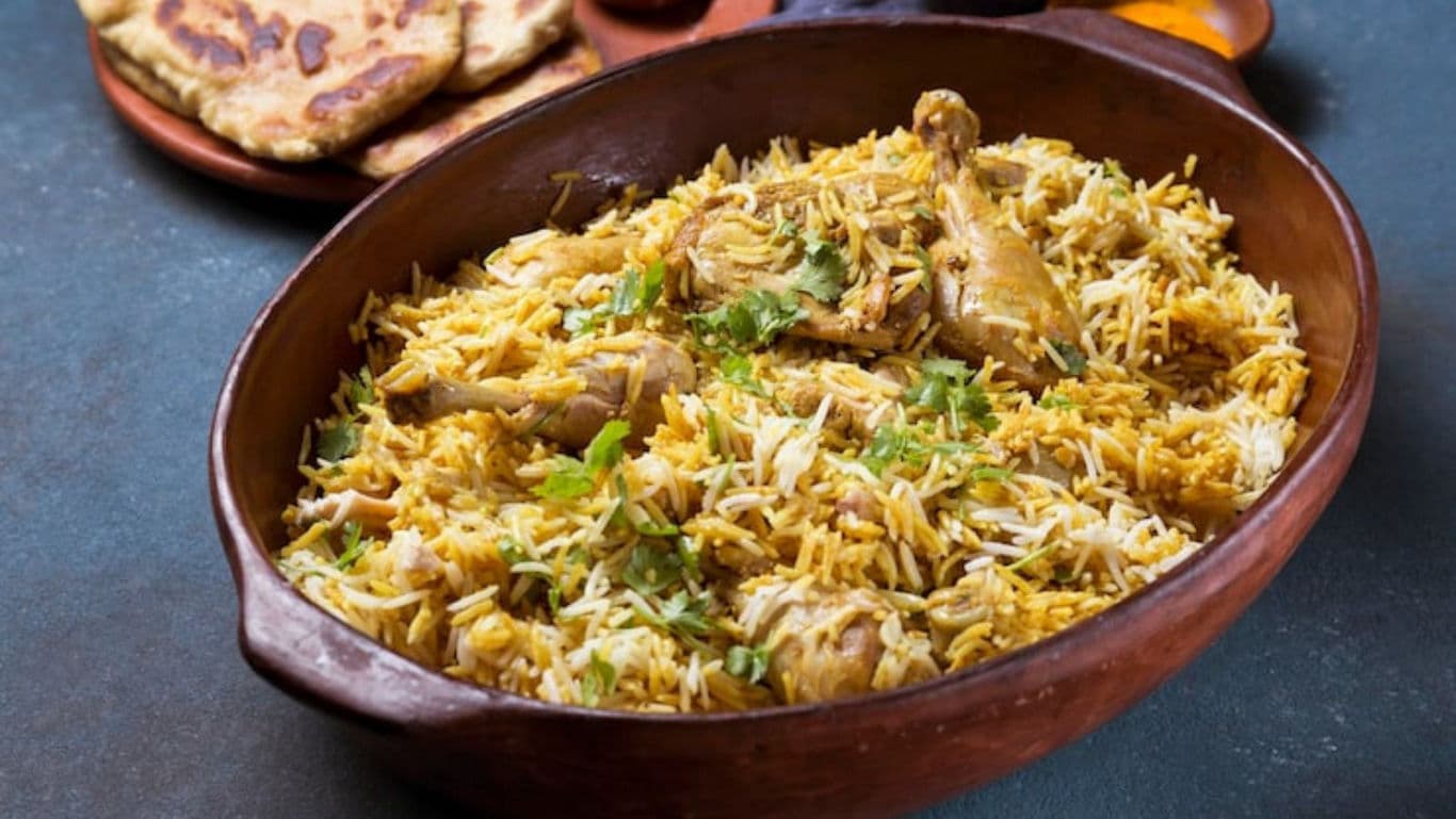 Chicken biryani served in rustic bowl