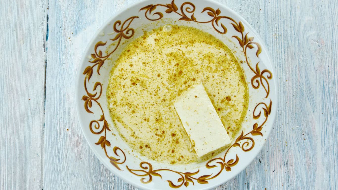 Creamy soup with spice and tofu block