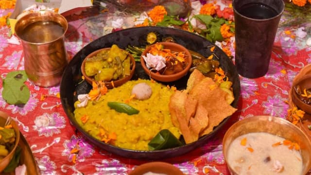 Bengali Bhog Thali served during Durga Puja in front of the deity.