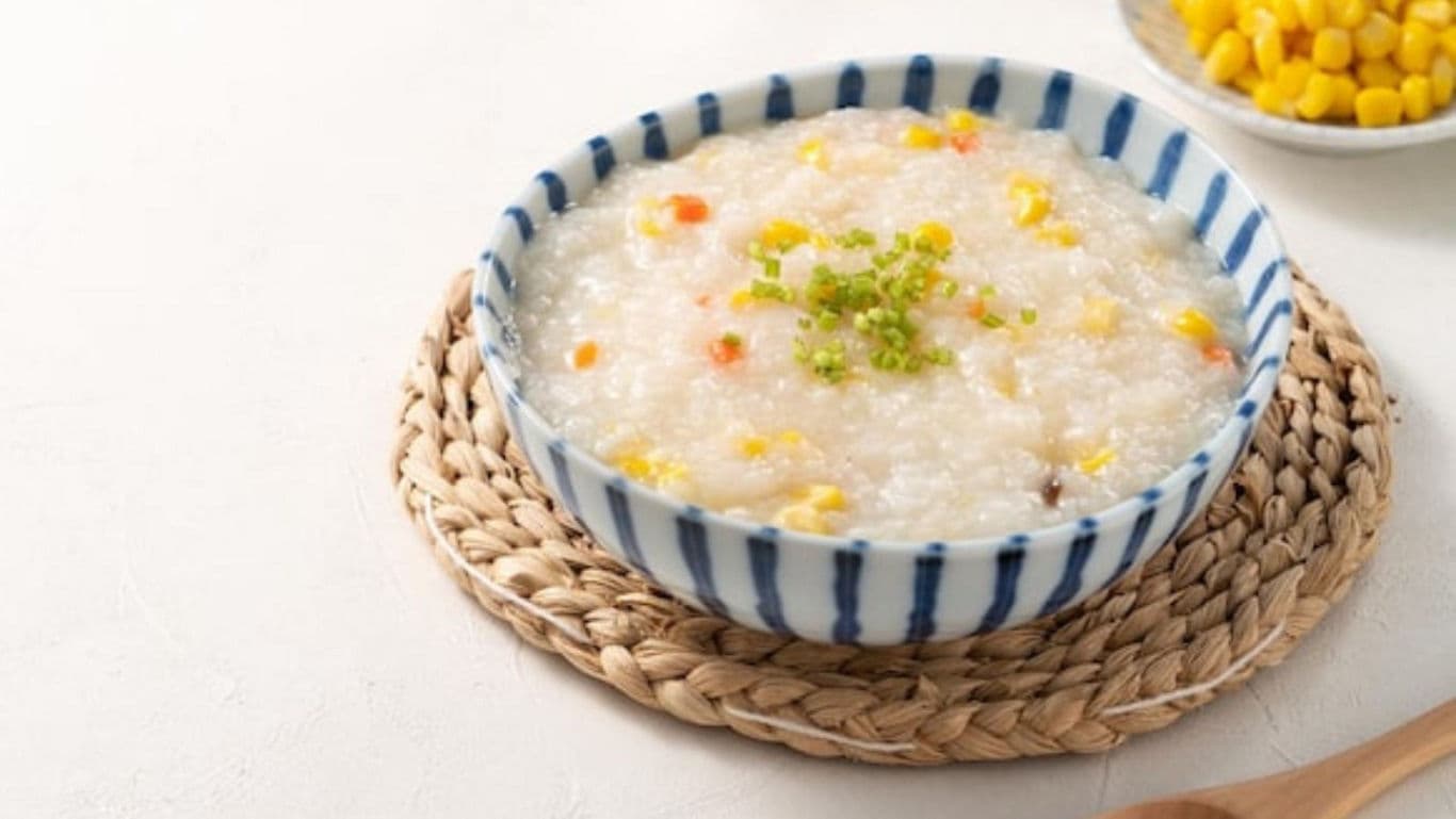 A bowl of nutritious rice kanji with corn and vegetables