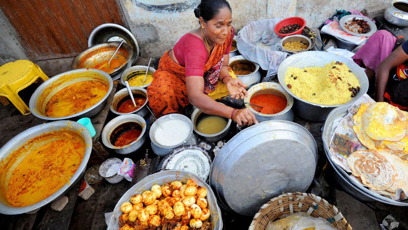 woman selling south indian street food