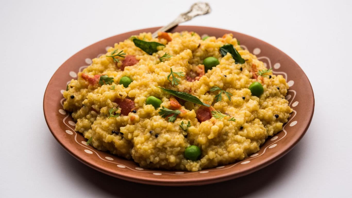 A bowl of moong dal khichdi with veggies