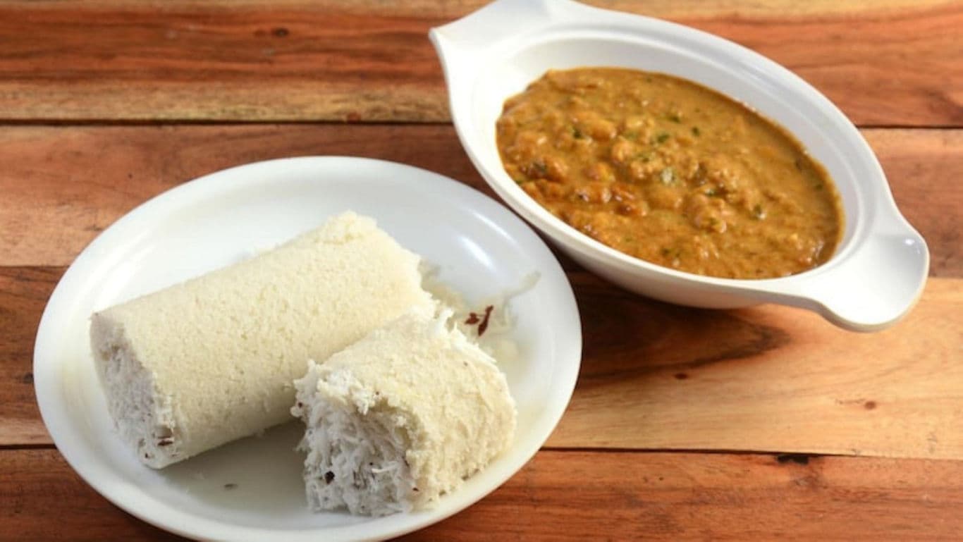 Kerala-style South Indian breakfast spread featuring puttu, kadala curry.