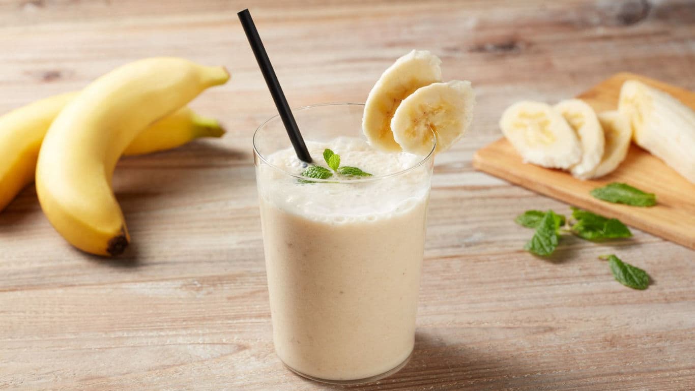 Banana smoothie with fresh mint garnish