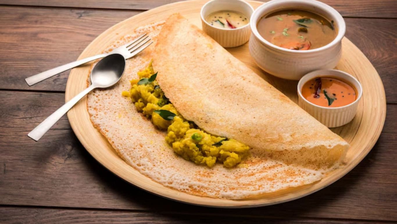 Masala dosa with chutneys and sambar