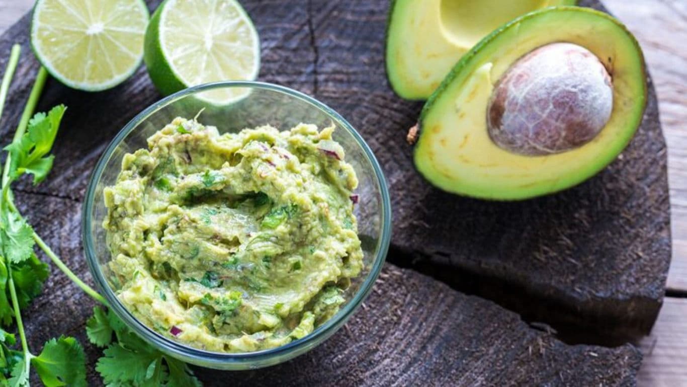 Fresh guacamole with avocado and lime