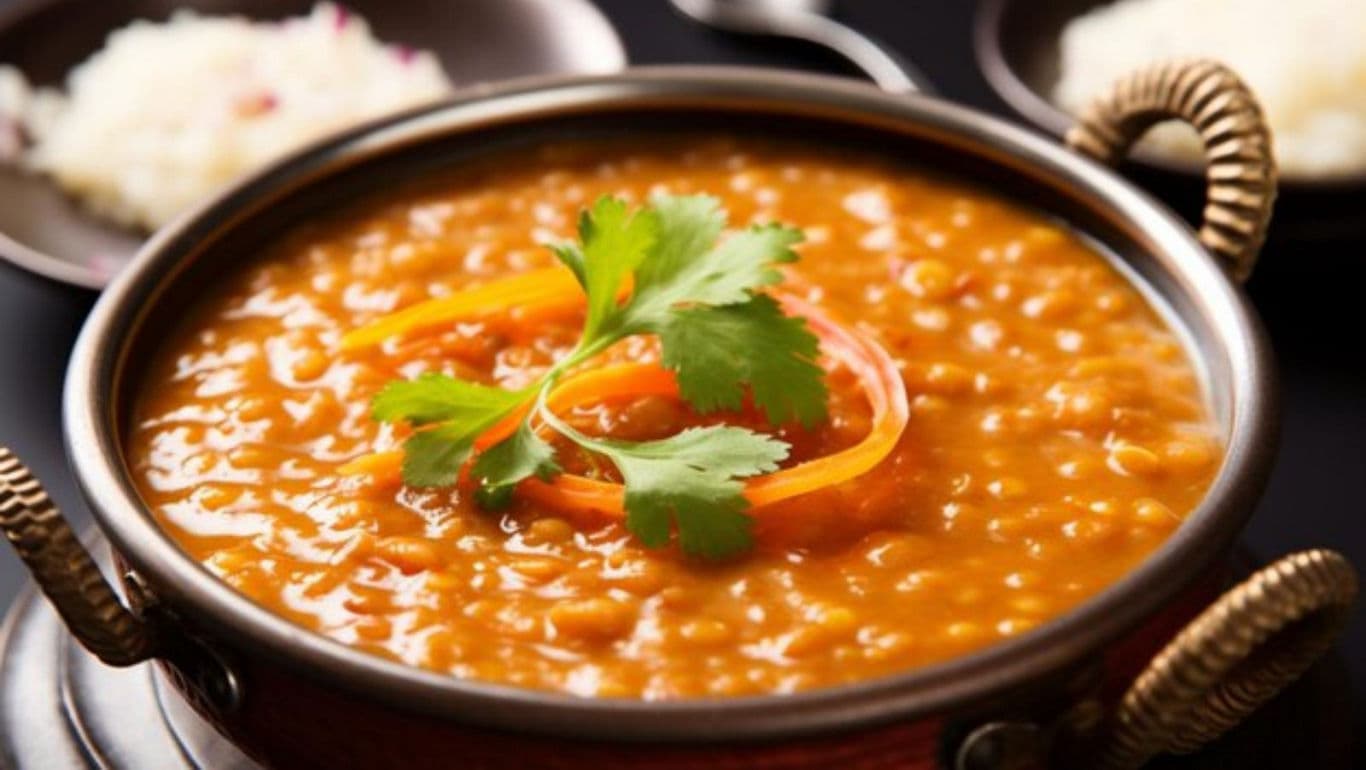Delicious lentil curry in copper bowl