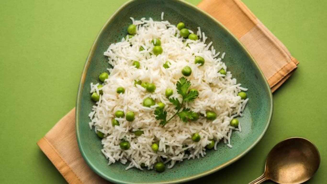 Green peas rice served in triangular bowl