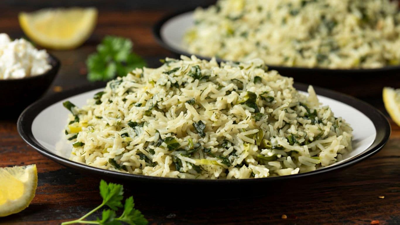 Plate of Spinach Rice with Lemon Slices