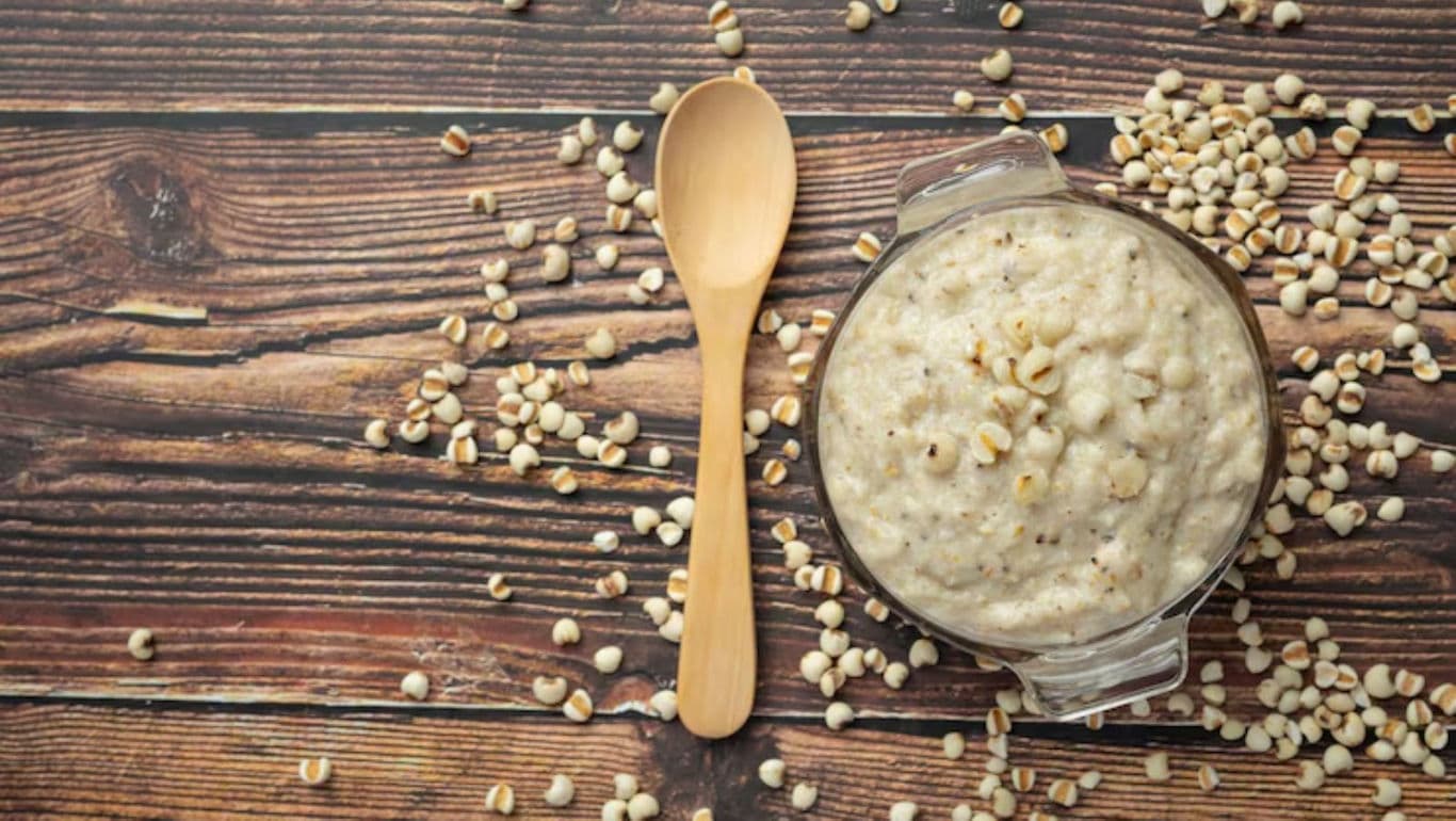 Creamy porridge with wooden spoon