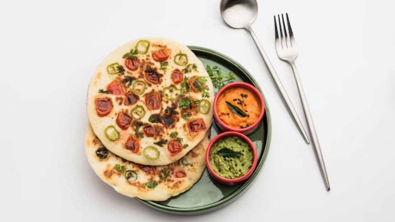 Vegetable flatbread with chutneys on green plate