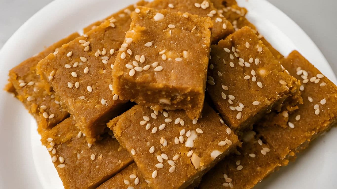 Sweet sesame squares on white plate