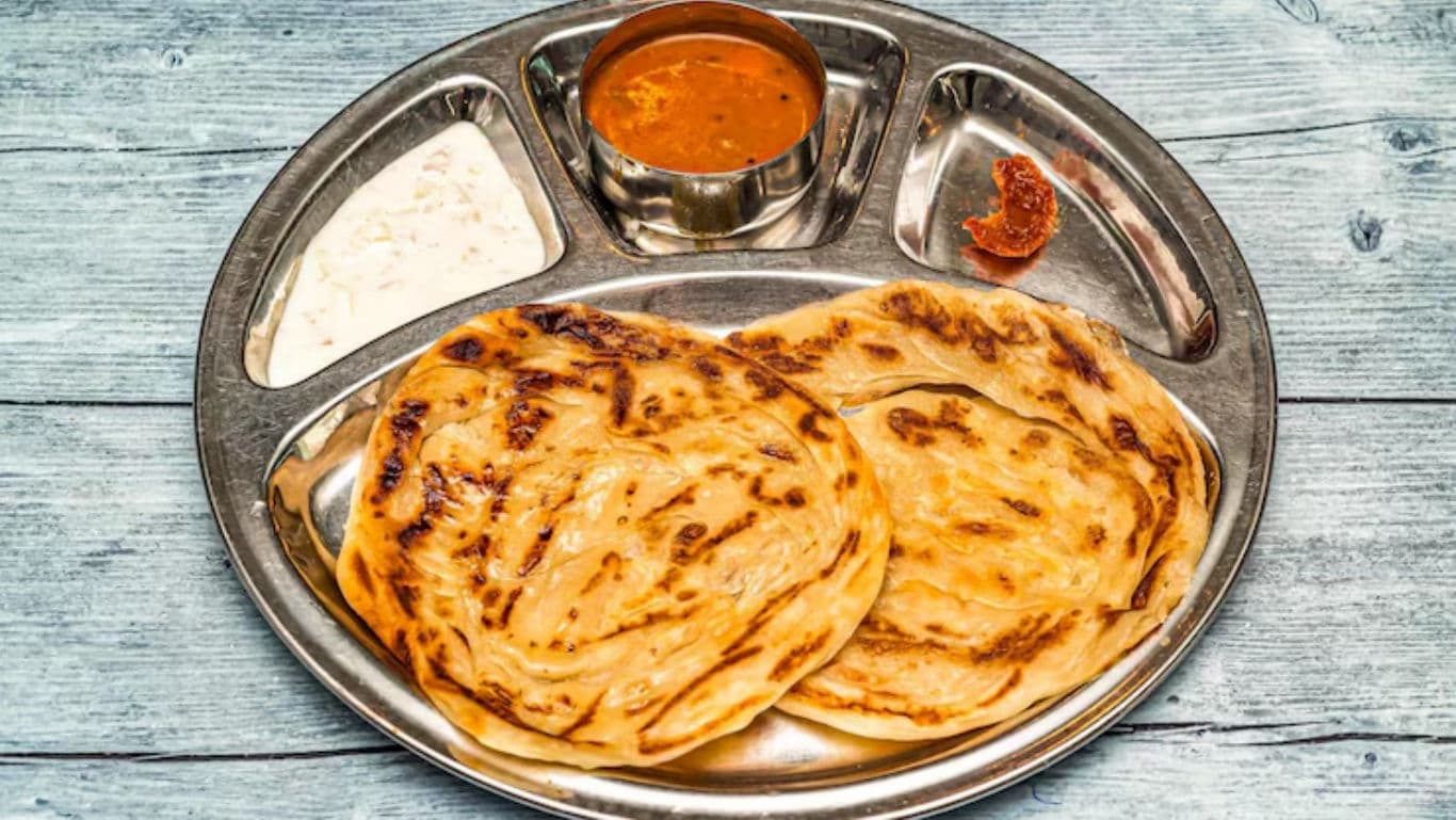 Indian paratha meal with curry and chutney